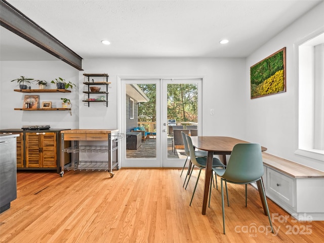 dining area with light wood-style floors, french doors, and recessed lighting
