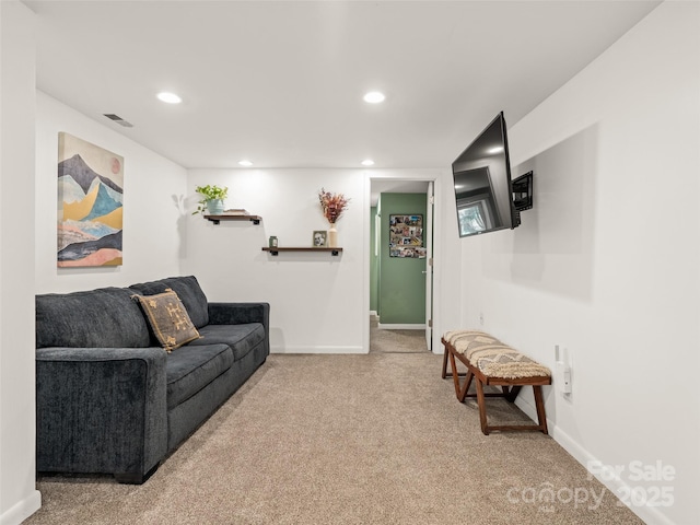 carpeted living room featuring recessed lighting, visible vents, and baseboards