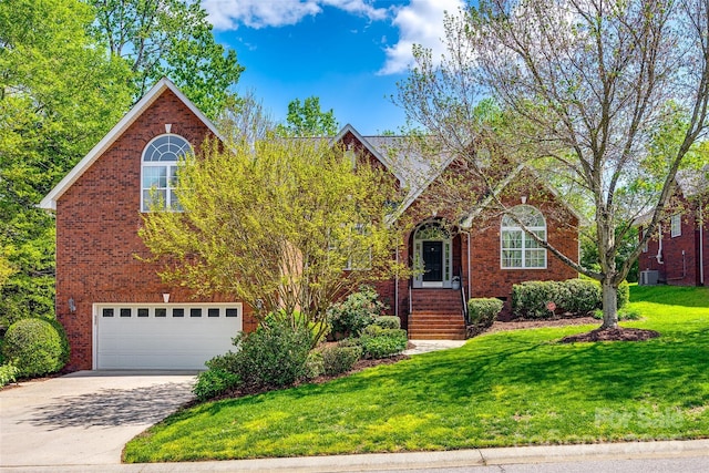 1126 Blowing Rock Cv, Fort Mill, SC 29708 - traditional home featuring concrete driveway, a front yard, brick siding, and a garage