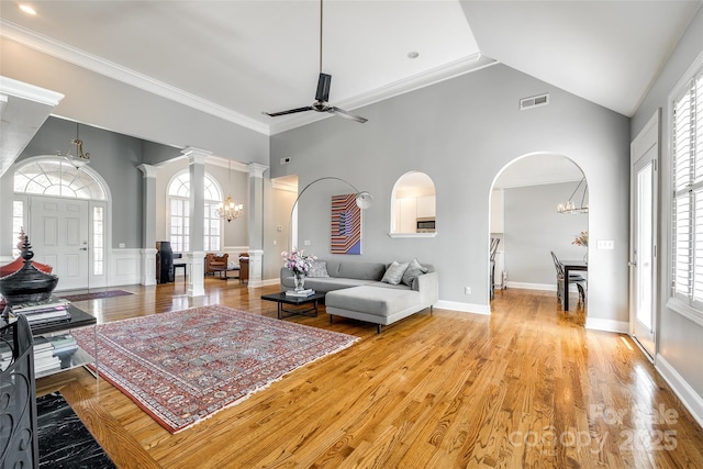 1126 Blowing Rock Cv, Fort Mill, SC 29708 - living room with a healthy amount of sunlight, ceiling fan with notable chandelier, a towering ceiling, and visible vents