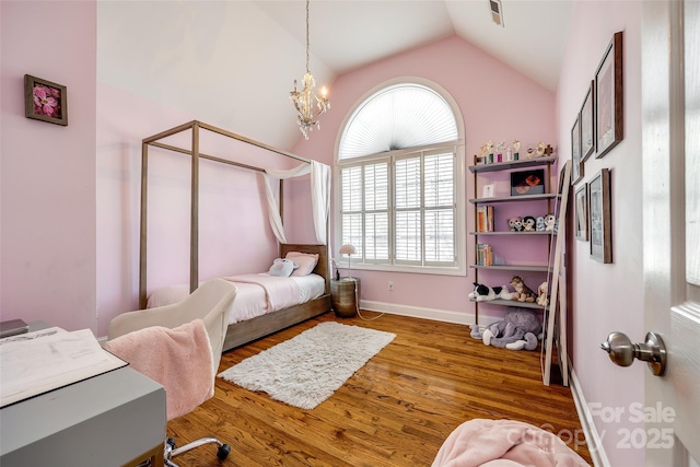 1126 Blowing Rock Cv, Fort Mill, SC 29708 - bedroom featuring baseboards, a notable chandelier, wood finished floors, and lofted ceiling