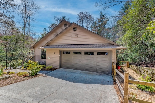 garage featuring driveway