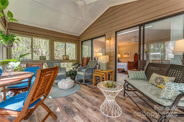 sunroom featuring ceiling fan