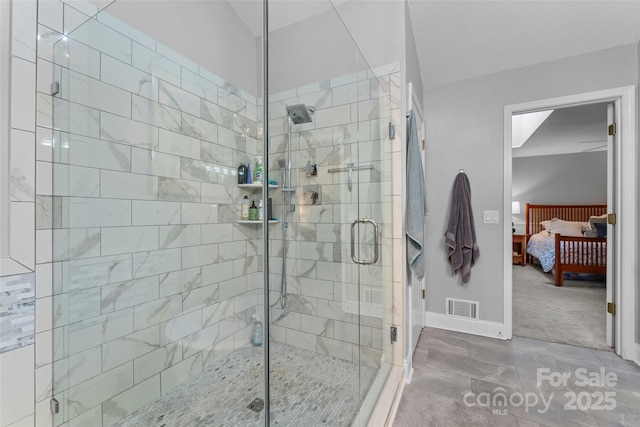 ensuite bathroom featuring a shower stall, visible vents, baseboards, and connected bathroom