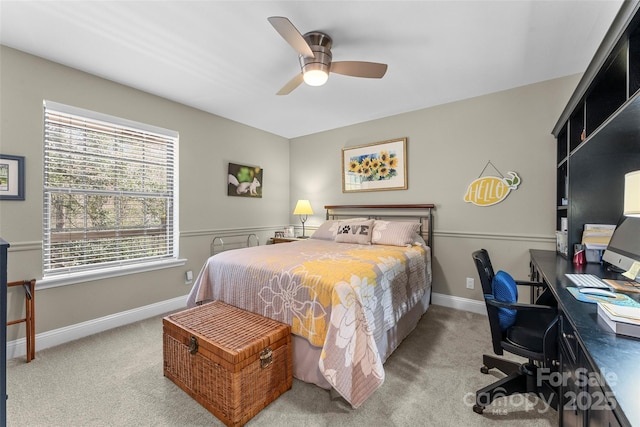 carpeted bedroom with baseboards and ceiling fan
