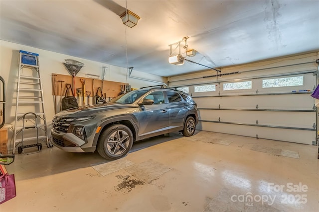 garage featuring a garage door opener