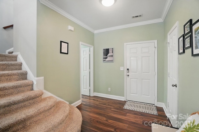 entrance foyer featuring wood finished floors, visible vents, stairway, and crown molding