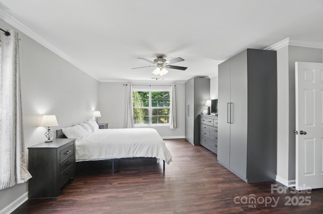 bedroom featuring dark wood finished floors, baseboards, and ornamental molding