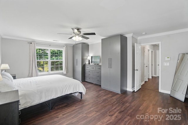 bedroom with dark wood-style flooring, baseboards, visible vents, a ceiling fan, and ornamental molding