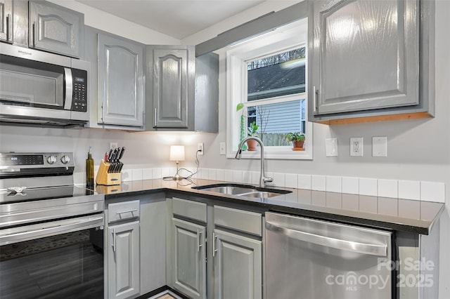 212 Short Michigan Ave, Asheville, NC 28806 - kitchen with a sink, dark countertops, gray cabinetry, and stainless steel appliances