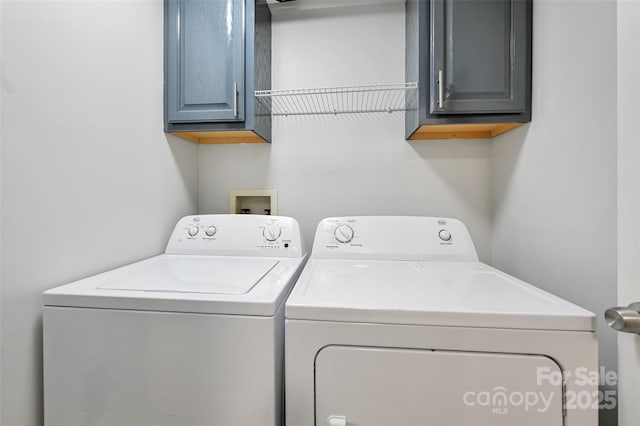 212 Short Michigan Ave, Asheville, NC 28806 - clothes washing area with separate washer and dryer and cabinet space