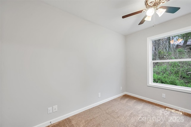 212 Short Michigan Ave, Asheville, NC 28806 - carpeted spare room featuring visible vents, baseboards, and a ceiling fan
