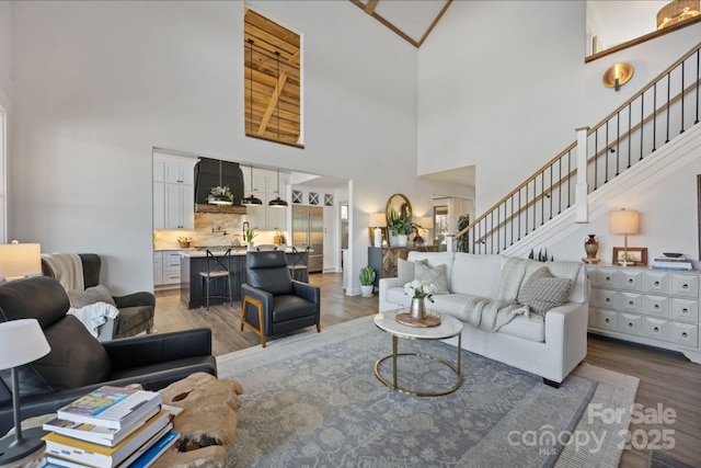 5888 Wood Duck Way, Catawba, NC 28609 - living area featuring a towering ceiling, stairs, and wood finished floors