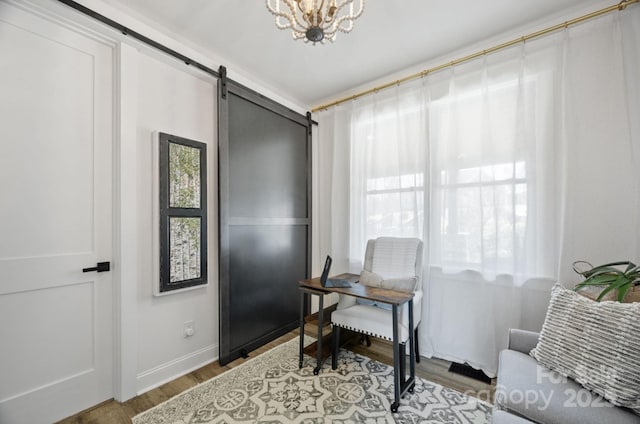 5888 Wood Duck Way, Catawba, NC 28609 - office with wood finished floors, a chandelier, baseboards, and a barn door