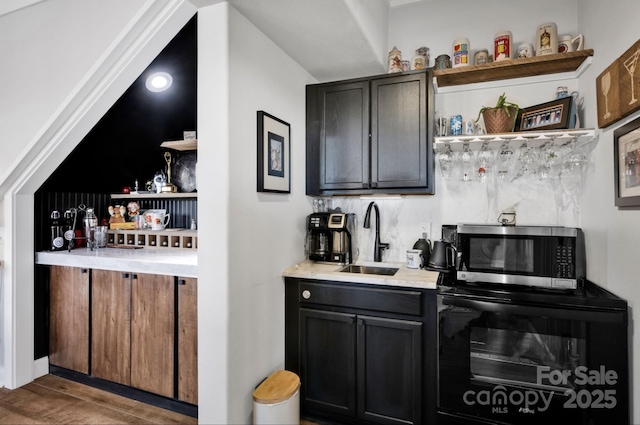 5888 Wood Duck Way, Catawba, NC 28609 - indoor wet bar featuring stainless steel microwave and wood finished floors