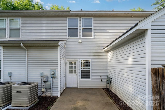back of house with a patio and central air condition unit