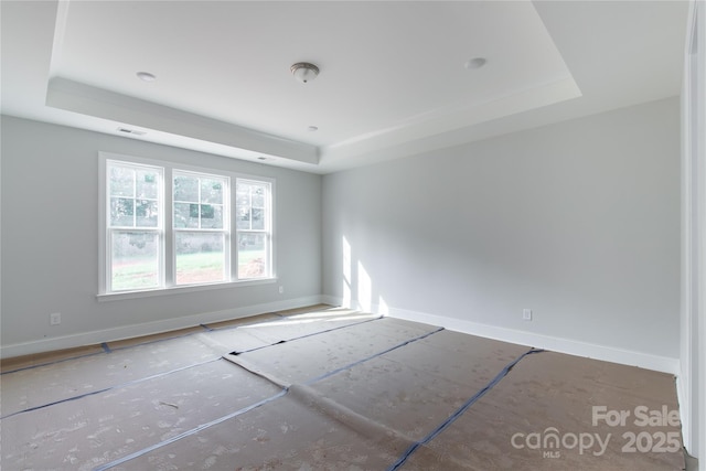1504 Baileys Run, Gastonia, NC 28056 - unfurnished room featuring a tray ceiling and baseboards
