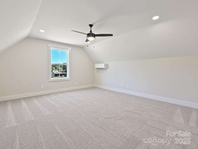 bonus room with ceiling fan, lofted ceiling, a wall mounted AC, and baseboards