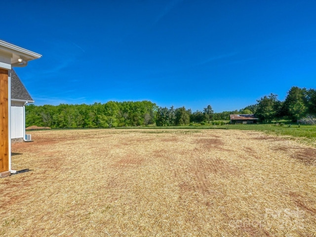 view of yard featuring a view of trees