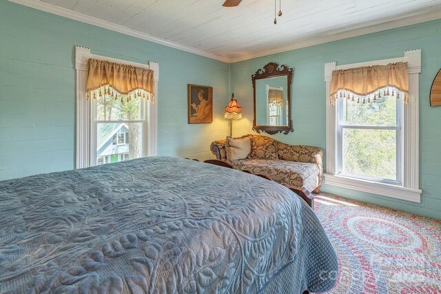 bedroom featuring multiple windows and crown molding