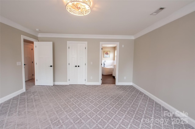8810 Cool Meadow Dr, Huntersville, NC 28078 - unfurnished bedroom featuring light carpet, baseboards, ornamental molding, and connected bathroom