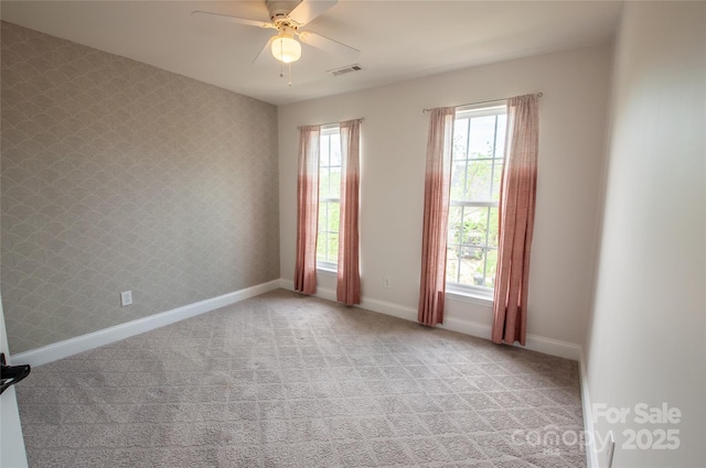 8810 Cool Meadow Dr, Huntersville, NC 28078 - empty room featuring healthy amount of natural light, light carpet, a ceiling fan, and baseboards