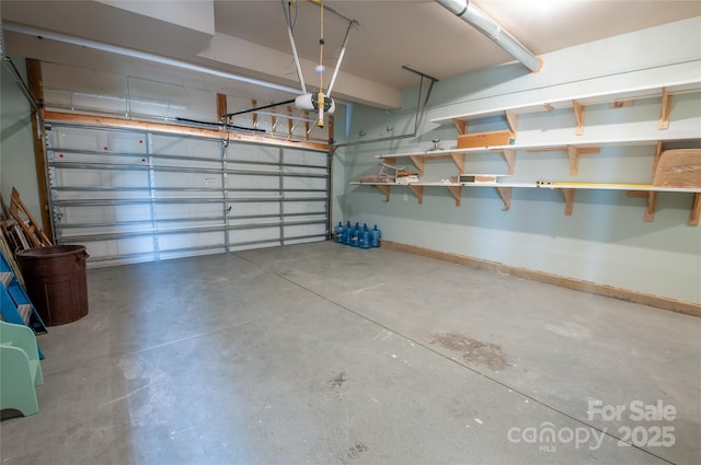 8810 Cool Meadow Dr, Huntersville, NC 28078 - garage featuring baseboards and a garage door opener