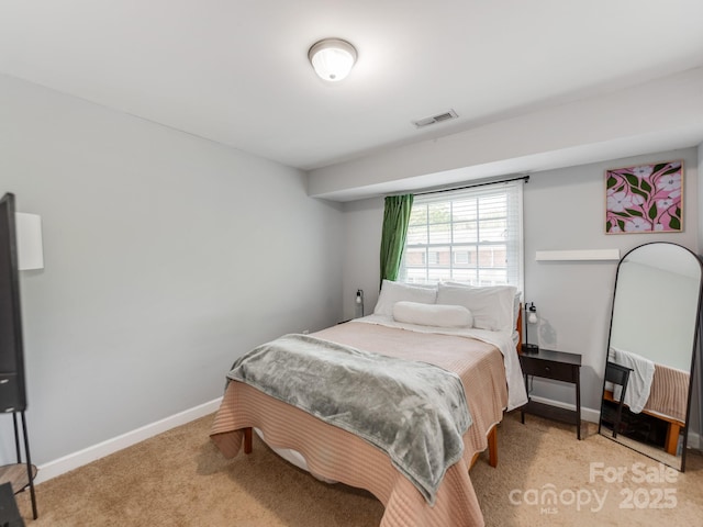 bedroom featuring visible vents, baseboards, and carpet floors