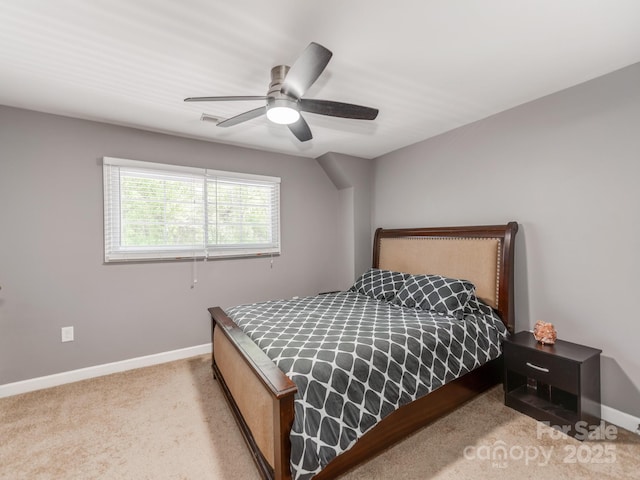 carpeted bedroom featuring visible vents, baseboards, and a ceiling fan