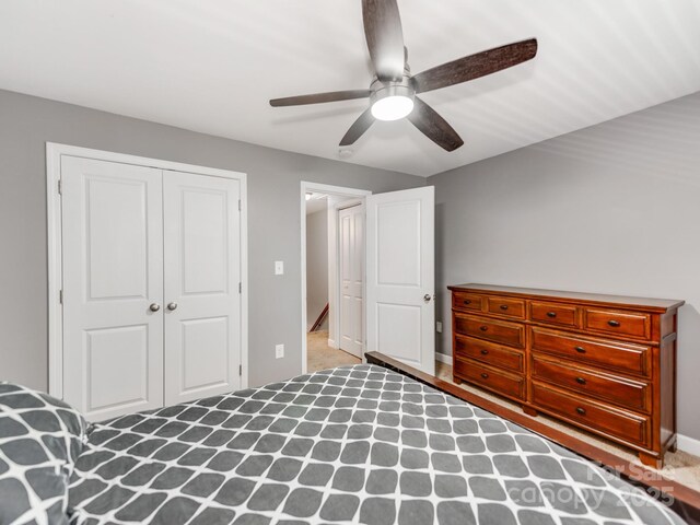 unfurnished bedroom with a closet, baseboards, and a ceiling fan