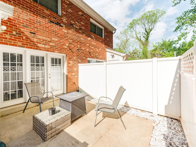 view of patio featuring fence