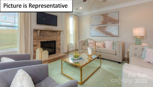 living room with crown molding, a healthy amount of sunlight, a stone fireplace, and recessed lighting