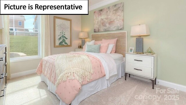 bedroom with light colored carpet and baseboards