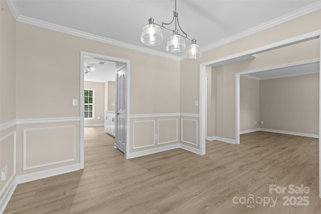 unfurnished dining area featuring light wood-type flooring and ornamental molding