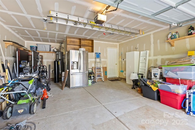 garage with a garage door opener, water heater, and stainless steel fridge with ice dispenser
