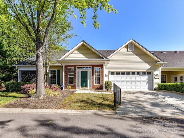 11705 Silverado Ln, Charlotte, NC 28277 - view of front of house with a garage, driveway, and brick siding