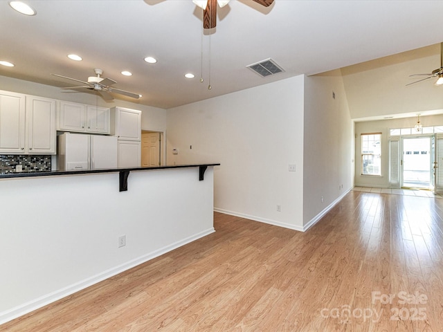 11705 Silverado Ln, Charlotte, NC 28277 - kitchen featuring ceiling fan, freestanding refrigerator, dark countertops, recessed lighting, and light wood finished floors