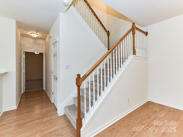 11705 Silverado Ln, Charlotte, NC 28277 - staircase with wood finished floors and baseboards