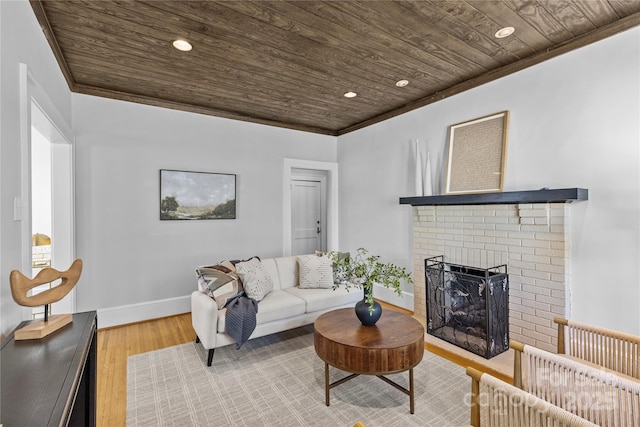 living room featuring a fireplace, recessed lighting, wood finished floors, and wood ceiling