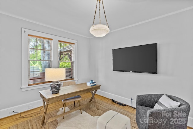 home office with crown molding, wood finished floors, and baseboards