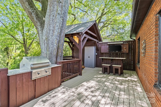 wooden terrace with area for grilling