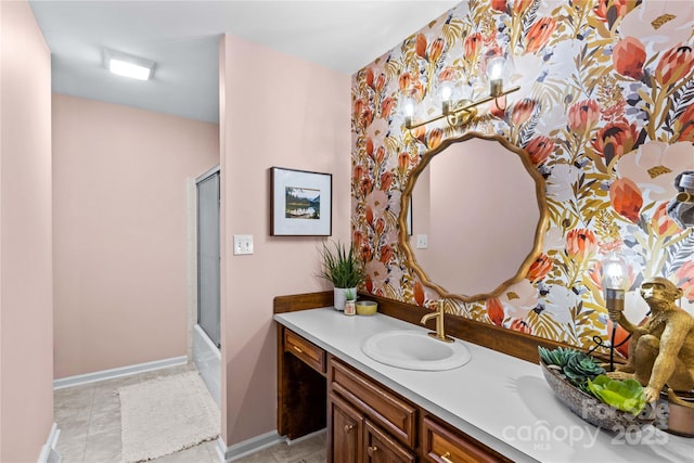 bathroom featuring tile patterned floors, vanity, and baseboards