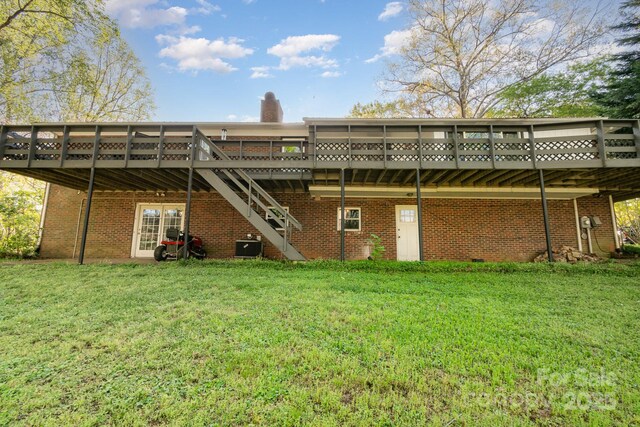 1218 Donna Dr, Shelby, NC 28152 - back of property with brick siding, stairs, a deck, and a lawn