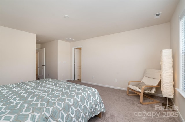 carpeted bedroom with baseboards and visible vents