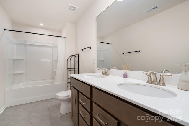 bathroom featuring a sink, visible vents, and tile patterned floors