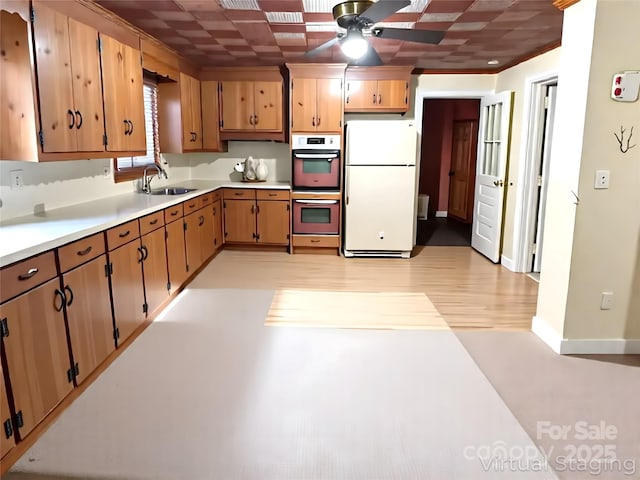 215 Old Dixie Rd, Lancaster, SC 29720 - kitchen featuring white appliances, ceiling fan, light countertops, and light wood-type flooring