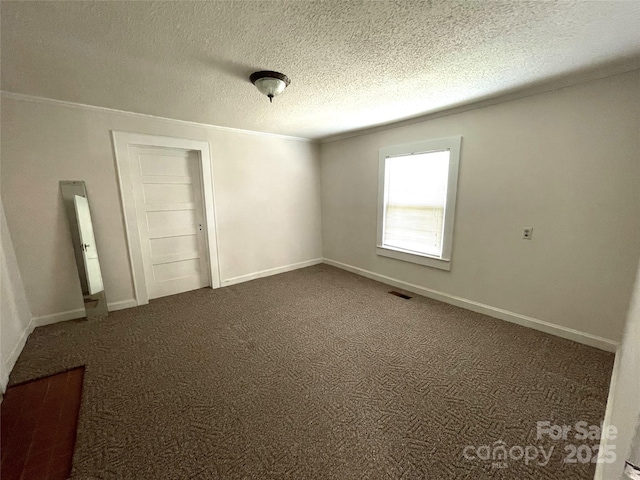 215 Old Dixie Rd, Lancaster, SC 29720 - empty room featuring ornamental molding, dark carpet, and a textured ceiling
