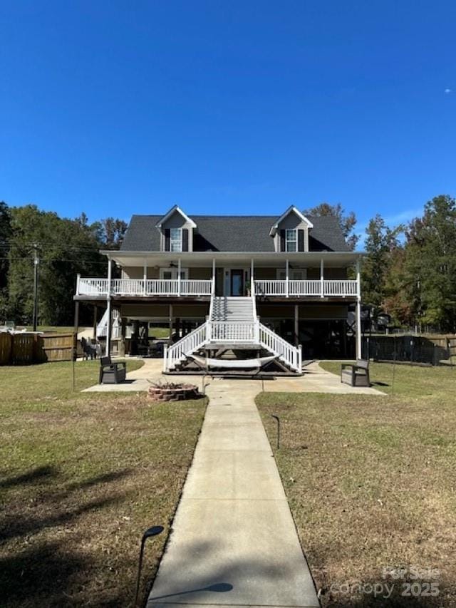 1273 Wateree Estates Rd, Winnsboro, SC 29180 - rear view of house with a patio area, stairway, and a lawn
