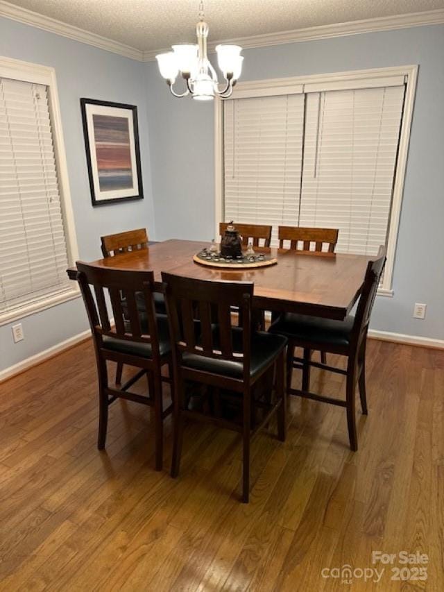 1273 Wateree Estates Rd, Winnsboro, SC 29180 - dining space with a chandelier, a textured ceiling, ornamental molding, and wood finished floors