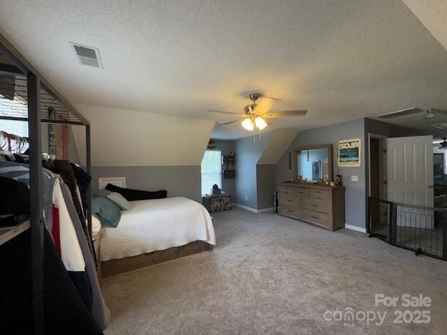 1273 Wateree Estates Rd, Winnsboro, SC 29180 - carpeted bedroom with visible vents, a textured ceiling, and vaulted ceiling